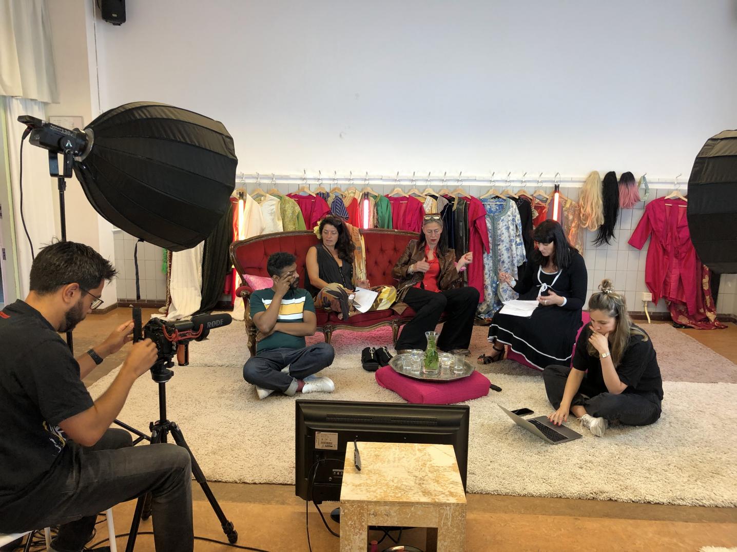 A group of people sitting on a sofa preparing for the recording of Artists in Conversation - edition Morocco 