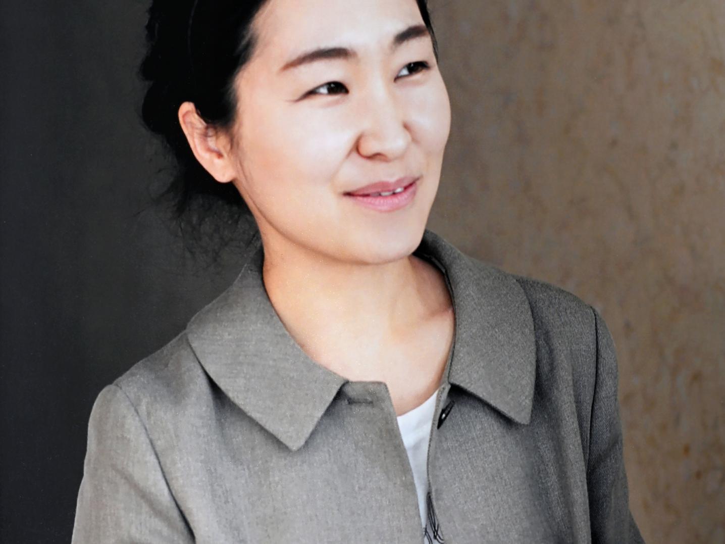 Portrait of woman holding paper