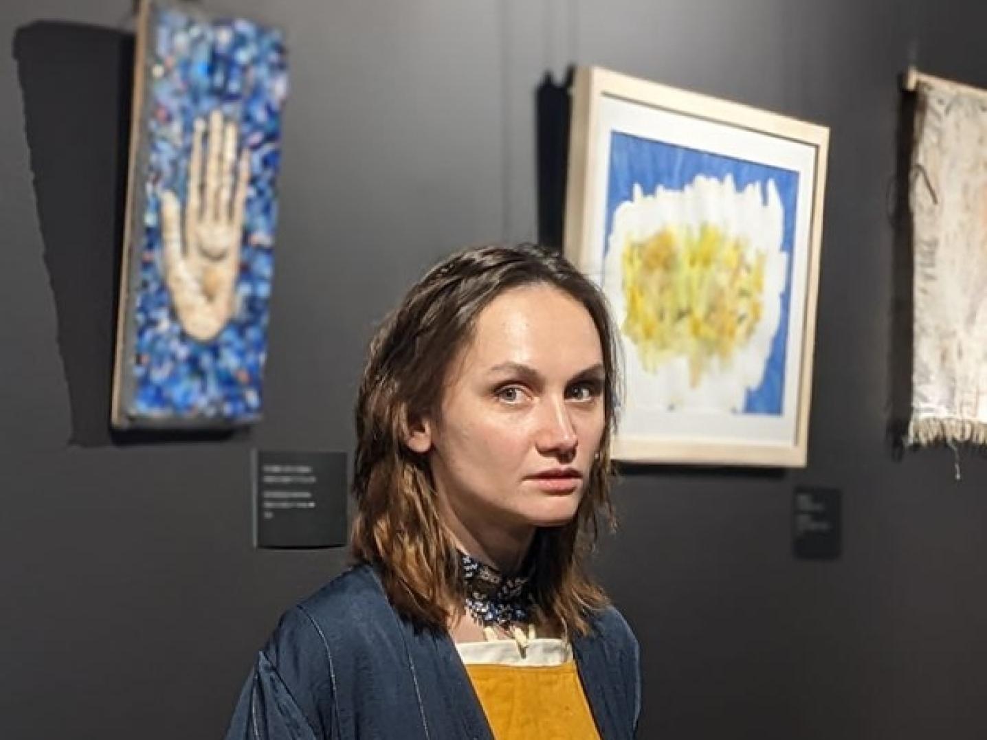 Girl with yellow dress in art space