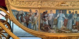 Left side panel of the Golden Coach, 'Tribute from the Colonies' by Nicolaas van der Waay.