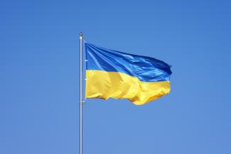 Ukrainian flag on blue sky background