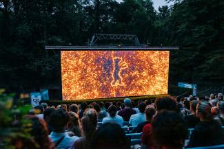 Berlinale open air cinema screen surrounded by trees and audience
