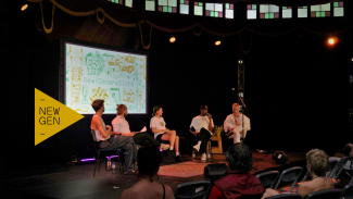 Five people having a panel discussion during the NewGen meeting at the Noorderzon Festival, pictured together with some of the audience.