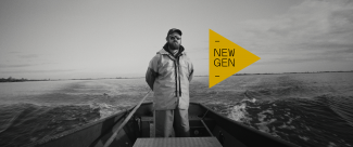 a man standing in a boat on the water