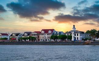 view on the waterfont of Paramaribo, Suriname, with coloured houses on the coast