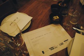 Programme of the event on a dining table