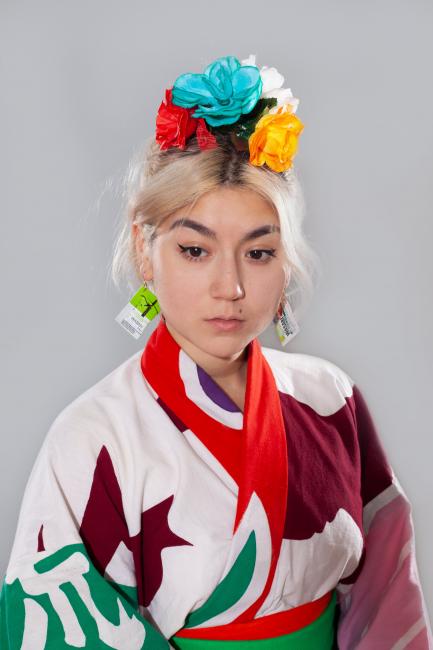 a Dutch-Japanese women waering a colourful dress and hair decoration