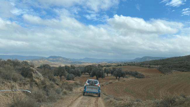 Car driving on a desrted road in the countryside in Spain