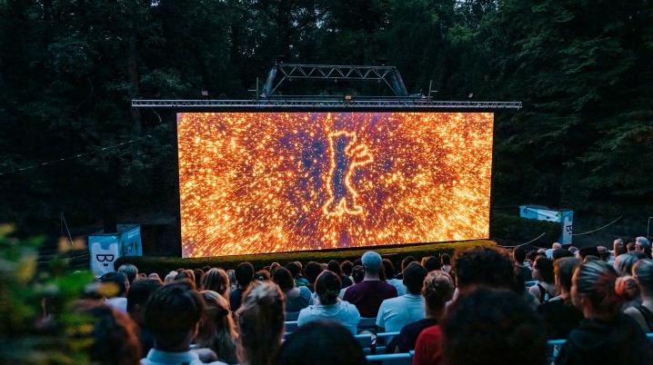 Berlinale open air cinema screen surrounded by trees and audience