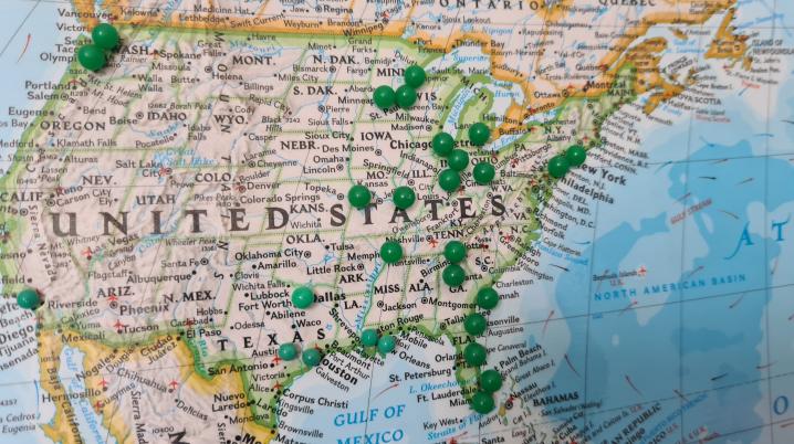 a map showing the USA with green pins on it