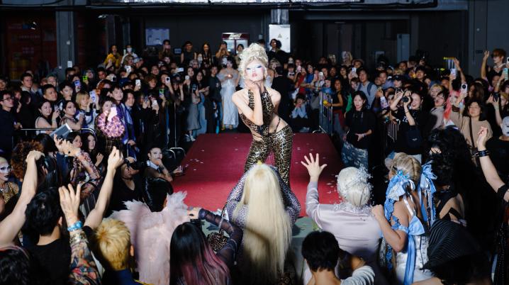 Performer in the middle of cheering crowd